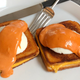 Illustration for article titled Eggs Benedict with grilled cheese and tomato soup hollandaise is the mashup of dreams